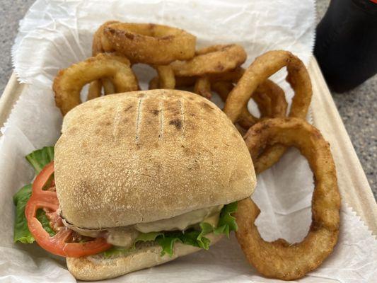 Uninspiring Tuna Melt with cardboard frozen Onion Rings at the Spreme Court Cafe.