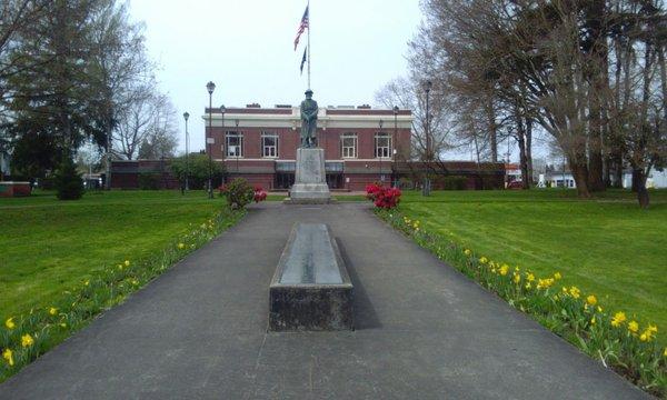 Looking West over the war memorial at the front of library.