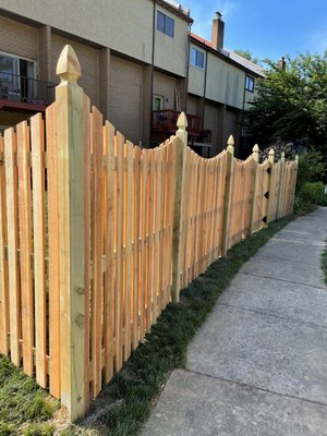 122' of 6' tall western red cedar solid board / scalloped shadow box fencing with (1) 4' wide gate and (1) 5' wide gate