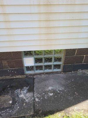 (1) Window with dryer vent located middle right looking from the outside