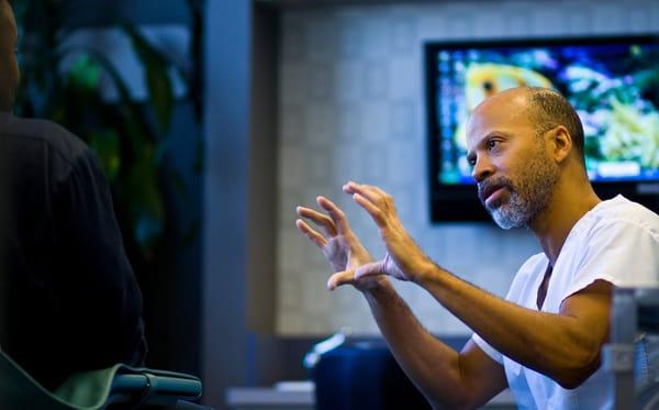 Dr. Cornell McCullom spends lots of time explaining procedures to patients.