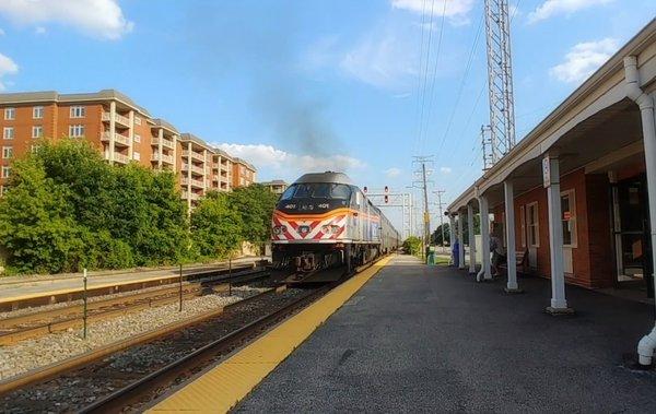 Metra train departing from Morton Grove station at 5 minutes drive to the southwest of Advanced Dentistry at Morton Grove