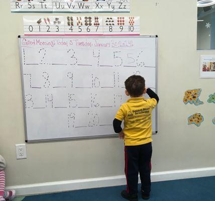 Practicing his numbers and fine motor skills during Circle Time