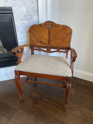 After repair. Beautiful wood work repair and brand new seat cushion.