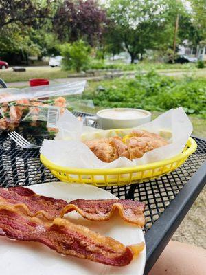 Egg sandwich with a side of bacon